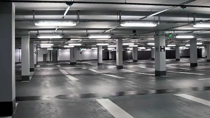 A Louisville area parking garage facility at night that has recently undergone Parking Garage Cleaning pressure washing service by HurriClean.