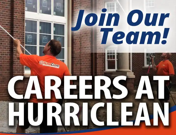 Workers wearing bright orange shirts pressure wash a brick building with a text overlay that reads Join Our Team Careers At HurriClean in a branded graphic.