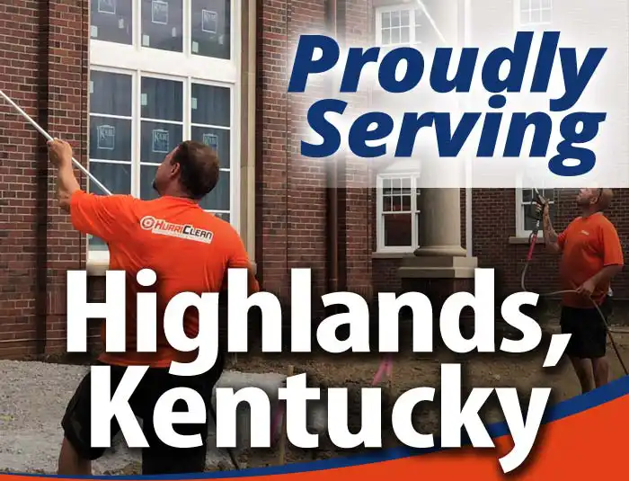 HurriClean technicians washing a building. They are wearing bright orange company shirts. Overlaid text that reads 'Proudly Serving Highlands, Kentucky'.