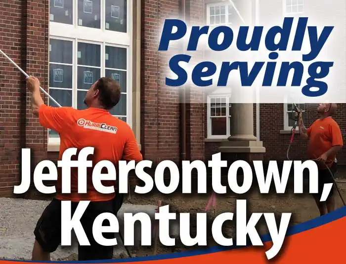 HurriClean workers washing a building. They are wearing bright orange uniform shirts. Text overlay that reads 'Proudly Serving Jeffersontown, Kentucky'.