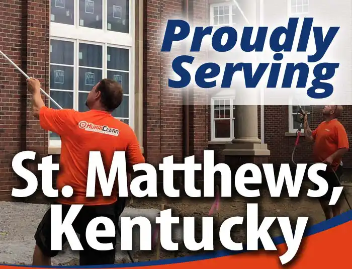 HurriClean Pressure Washing & Sealing technicians wearing bright orange company shirts soft washing a brick building with overlaid text that reads 'Proudly Serving St Matthews, Kentucky'.