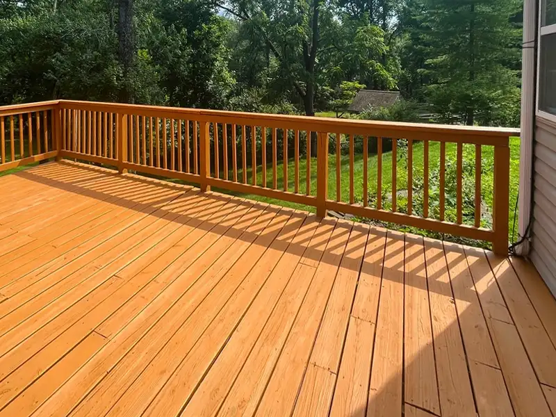 A backyard wood deck in the Goshen KY area professionally restored and stained a warm honey gold color.